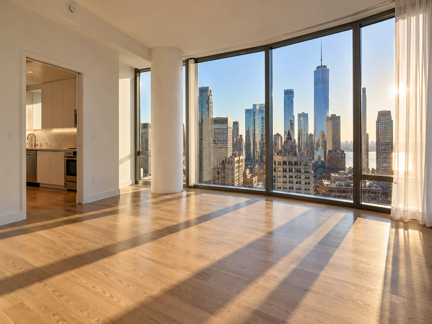 Marble lobby of a Financial District residential tower with concierge desk and closed elevator doors